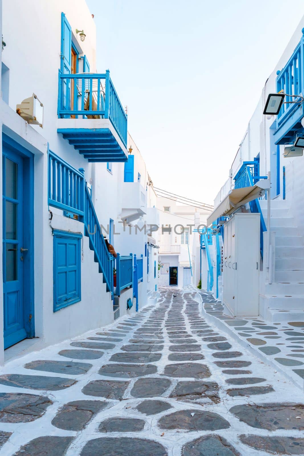 empty street of Mykonos Greek village in Greece, colorful streets of Mikonos village.