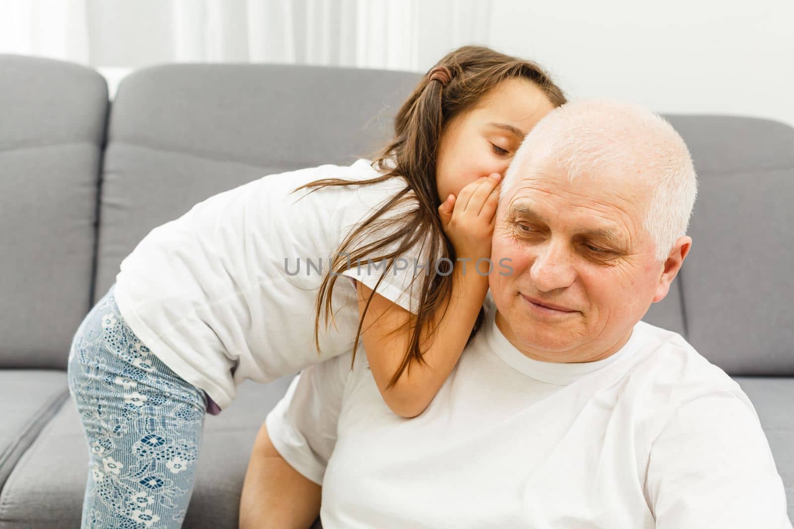Elderly man his granddaughter