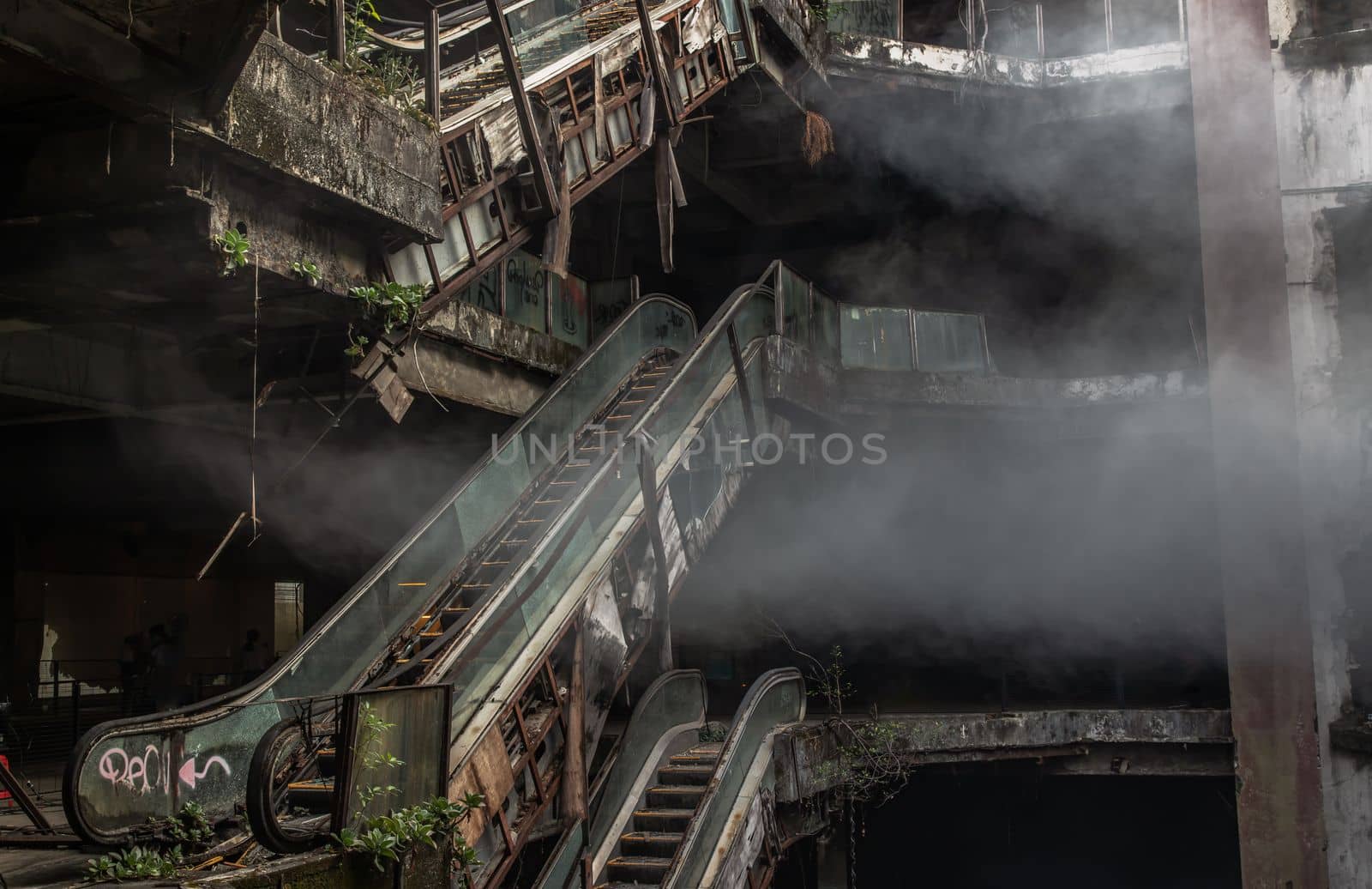 Bangkok, Thailand - 07 Feb 2022 : Damaged escalators in abandoned shopping mall building. Structural and ruins was left to deteriorate over time, New World Mall, Selective focus.