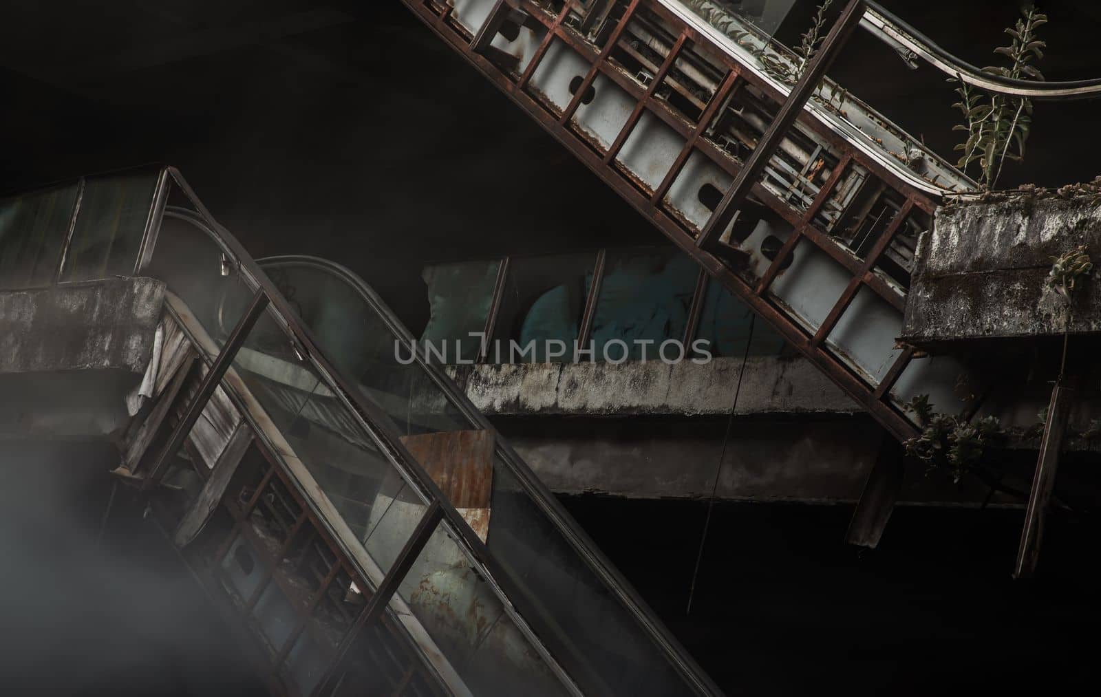 Bangkok, Thailand - 07 Feb 2022 : Damaged escalators in abandoned shopping mall building. Structural and ruins was left to deteriorate over time, New World Mall, No focus, specifically.