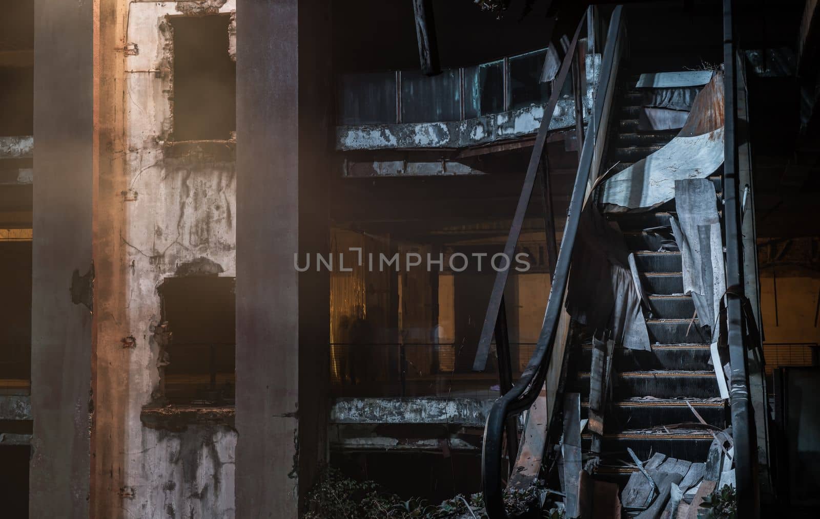 Damaged escalator in abandoned shopping mall building. Structural and ruins was left to deteriorate over time, New World Mall, Selective focus.