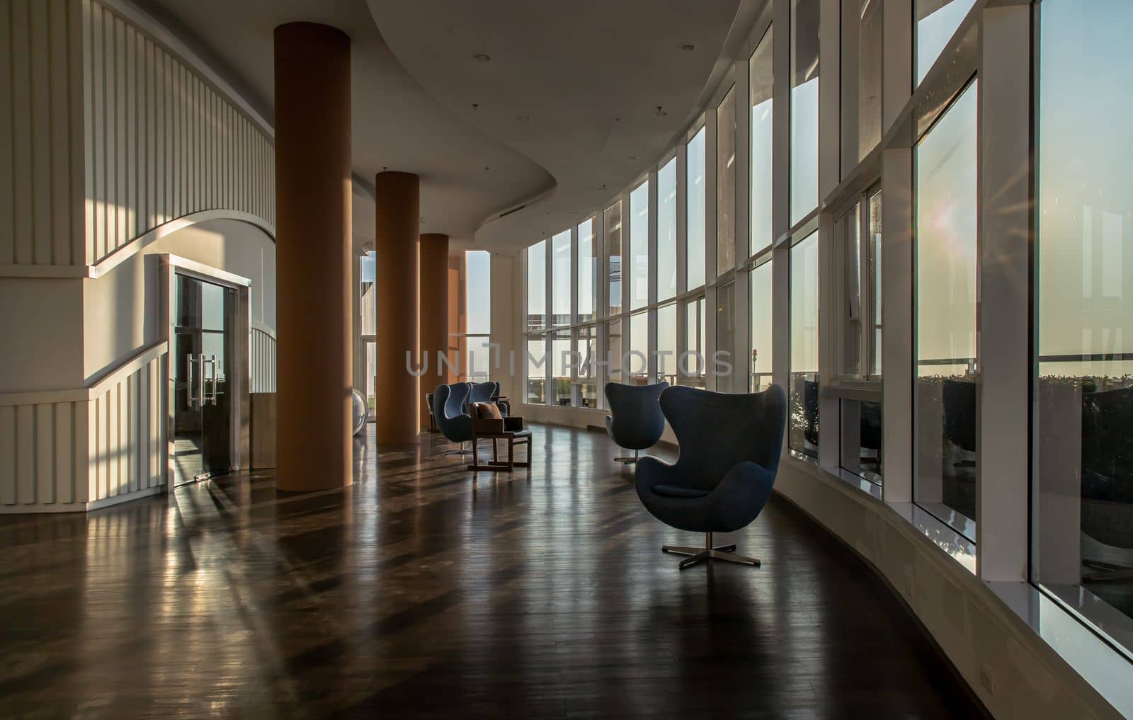 Bangkok, Thailand - Jan 10, 2022 : Common area of condominium in morning. New normal, The seats were set separately according to social distancing policy for the spread of covid-19 prevention, Selective focus.