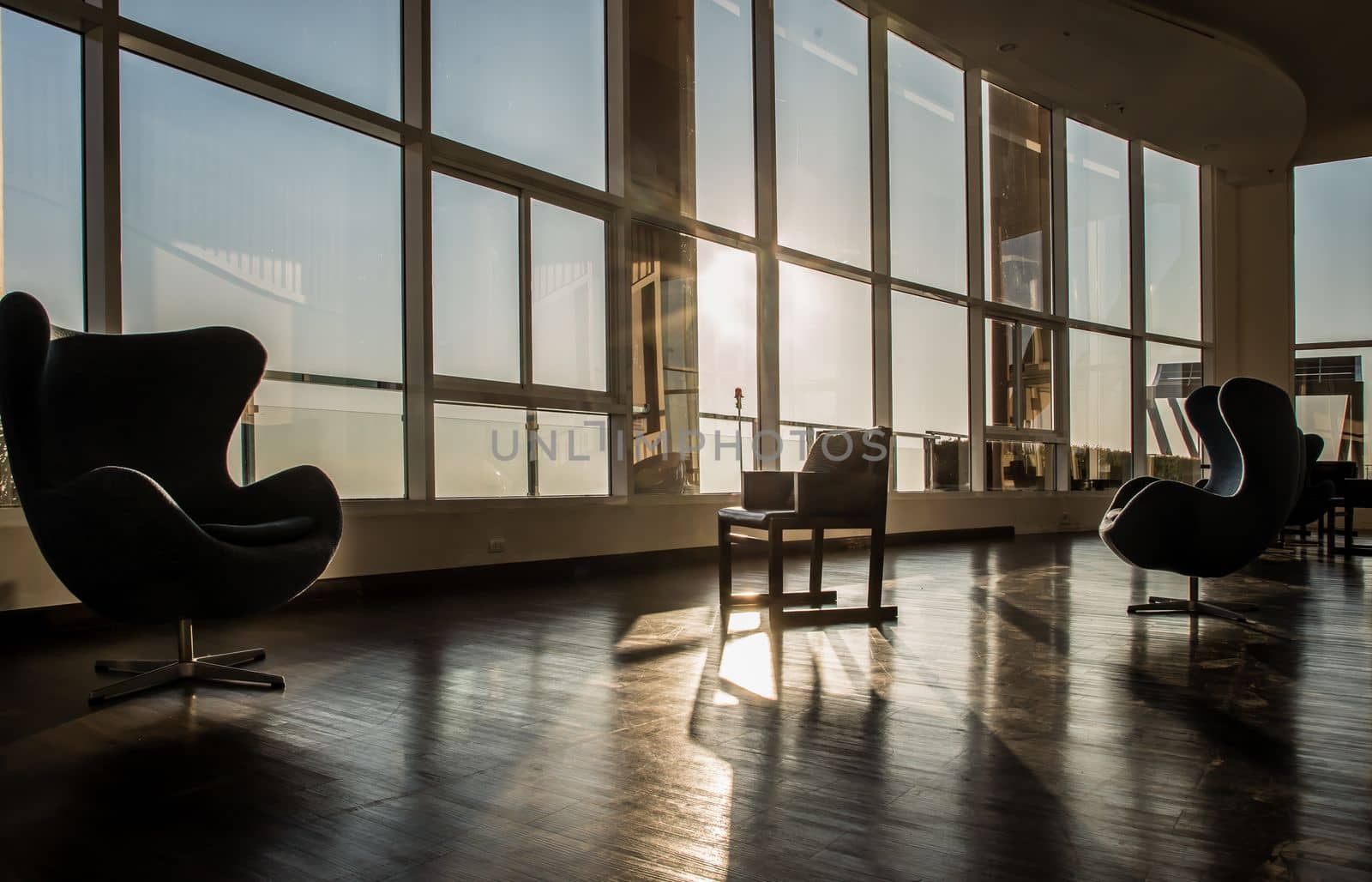 Bangkok, Thailand - Jan 10, 2022 : Common area of condominium in morning. New normal, The seats were set separately according to social distancing policy for the spread of covid-19 prevention, Selective focus.