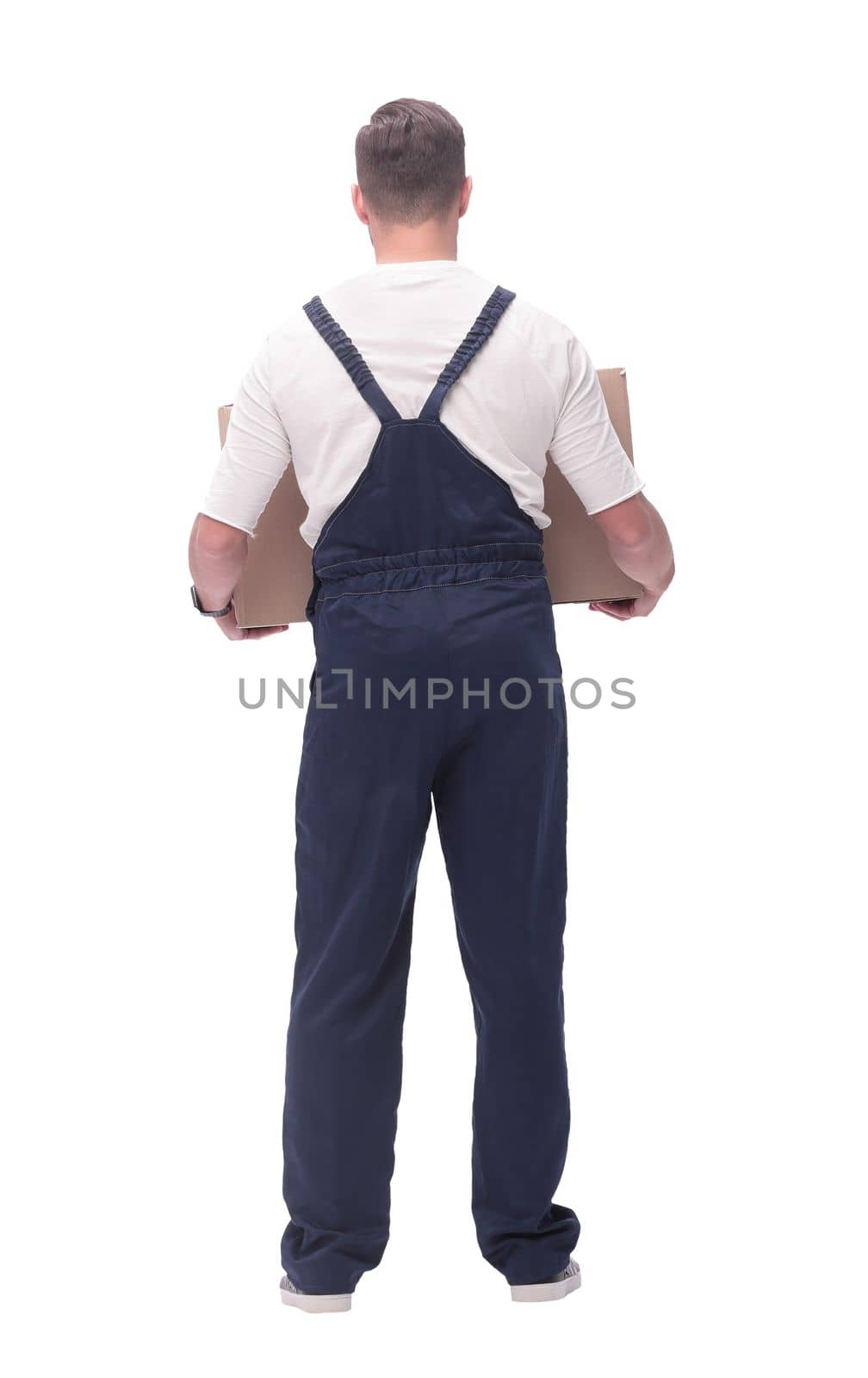 rear view. a young man with a large cardboard box. photo with copy space