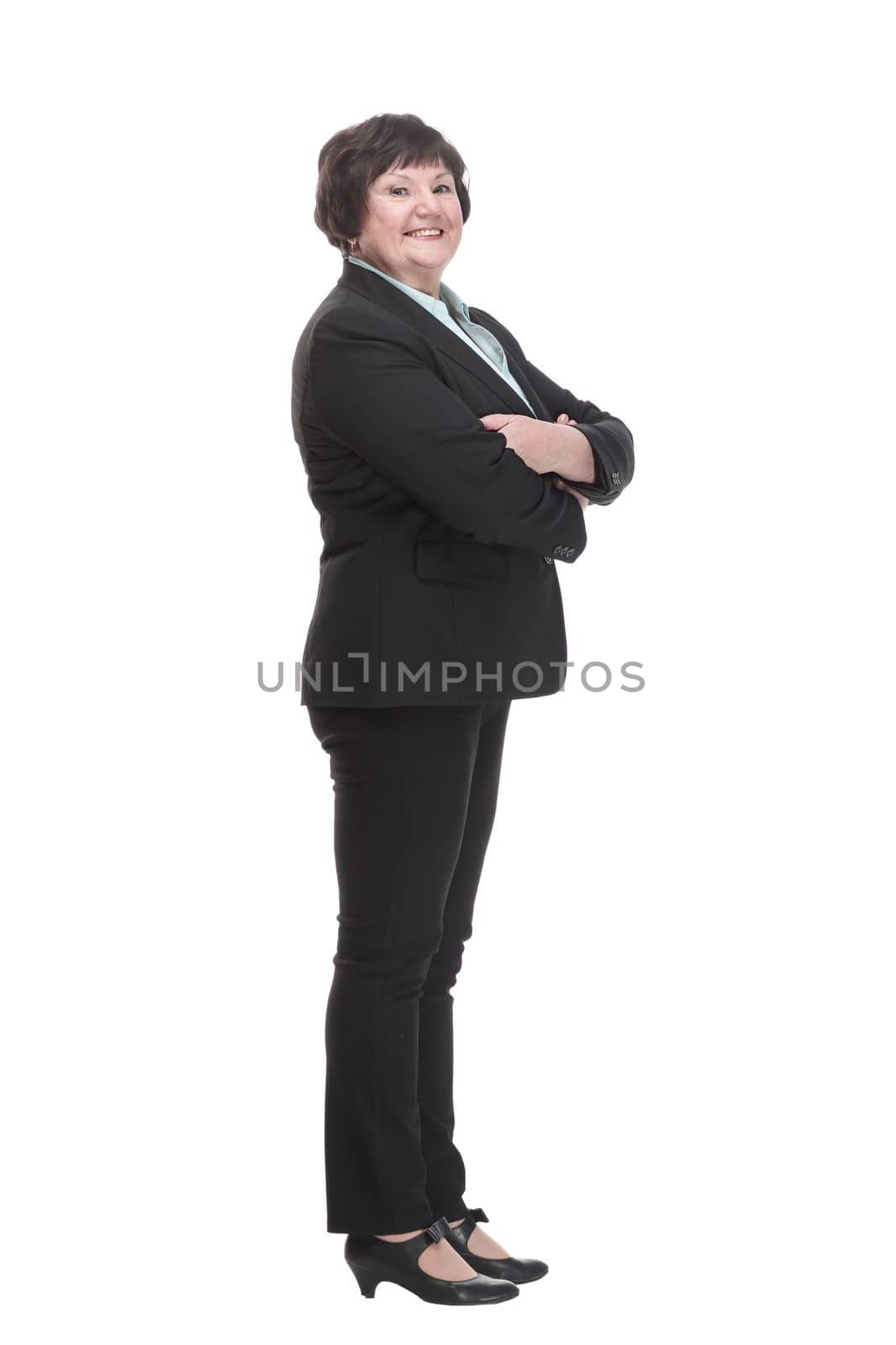 Mature business woman in a black pantsuit . isolated on a white background.