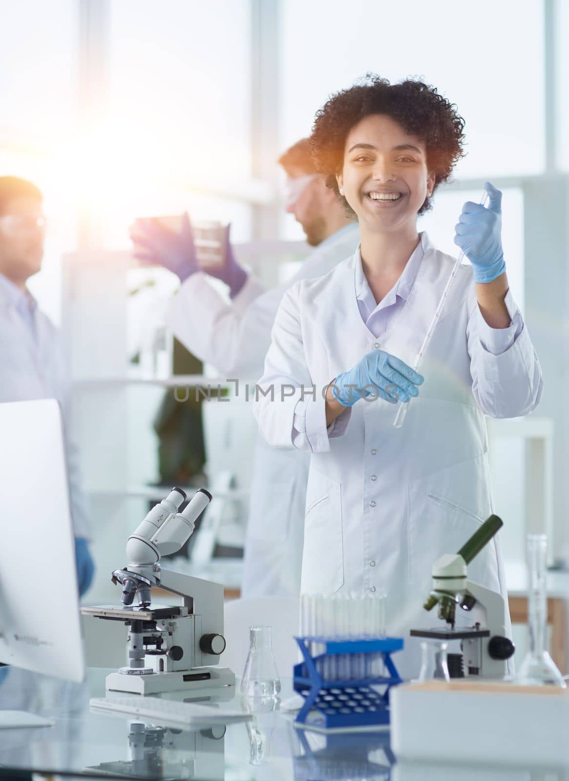 Scientists smiling together in lab