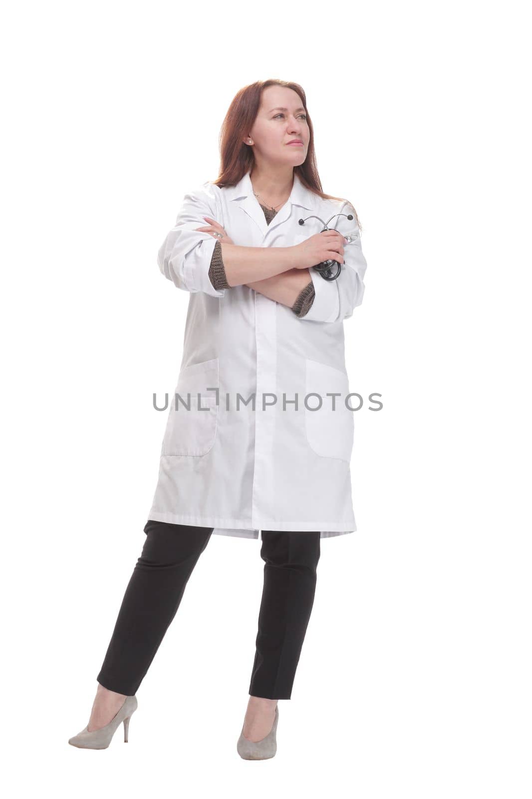 in full growth. qualified female doctor with a stethoscope in her hand. isolated on a white background.