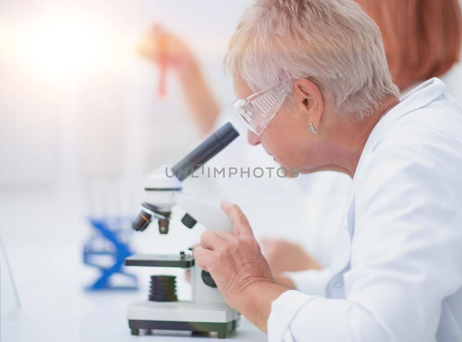 female scientist conducts research in the laboratory. by asdf