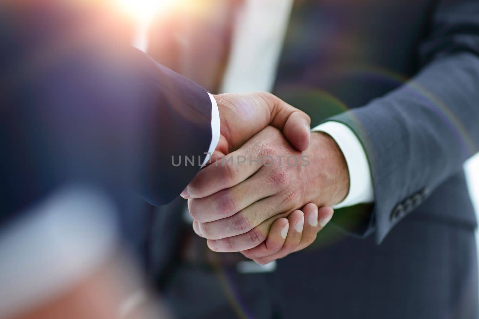 Close-up view of the hands of a businessman in the office in the formal wear.
