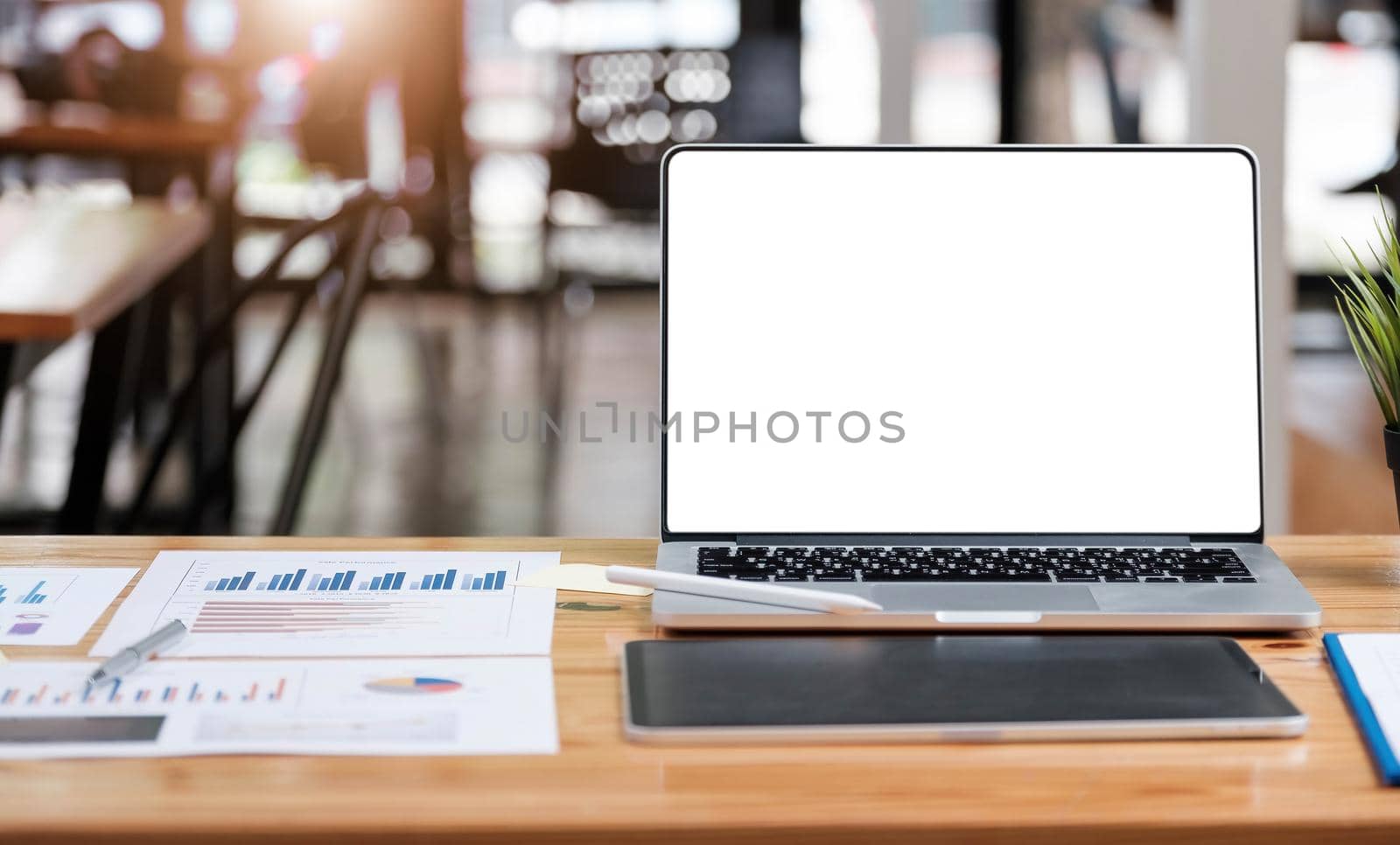 Laptop with blank screen on table. Workspace background new project on laptop computer with blank copy space screen for your advertising text message by wichayada