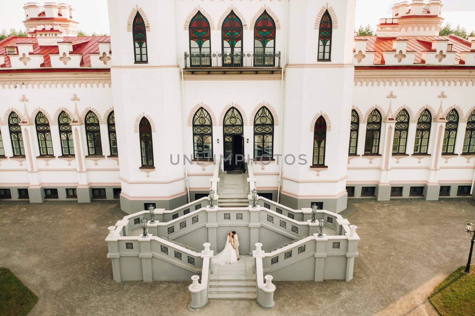 A wedding couple at the Kossovsky Palace in Belarus.Puslovsky Palace.