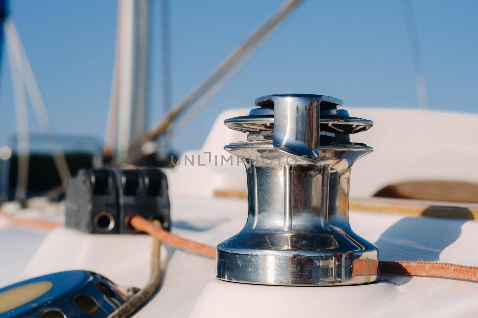 rope on the winch of a white yacht in the sea.yacht equipment.