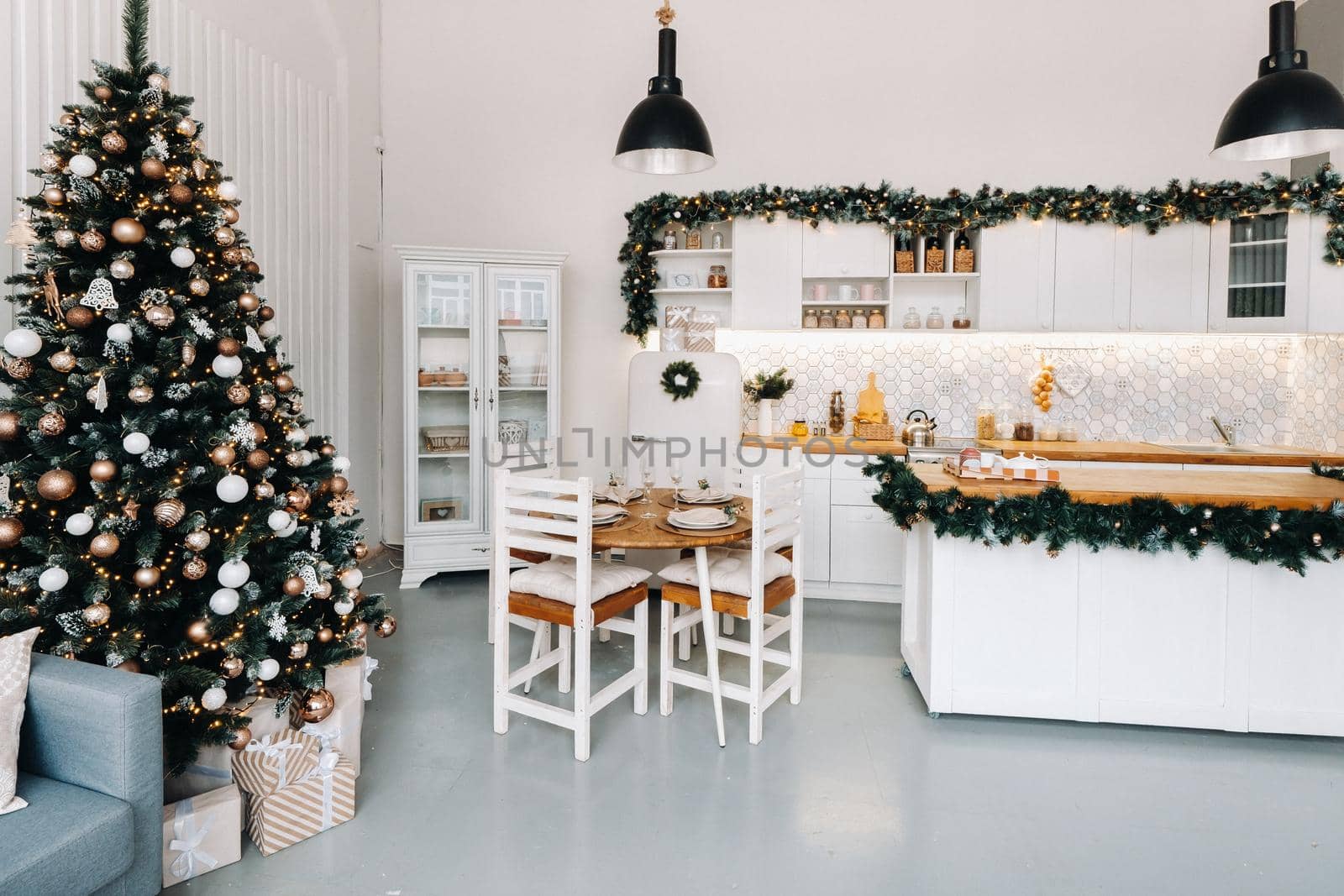 Christmas tree in the home Christmas interior in the kitchen.Decorated Christmas photo zone by Lobachad