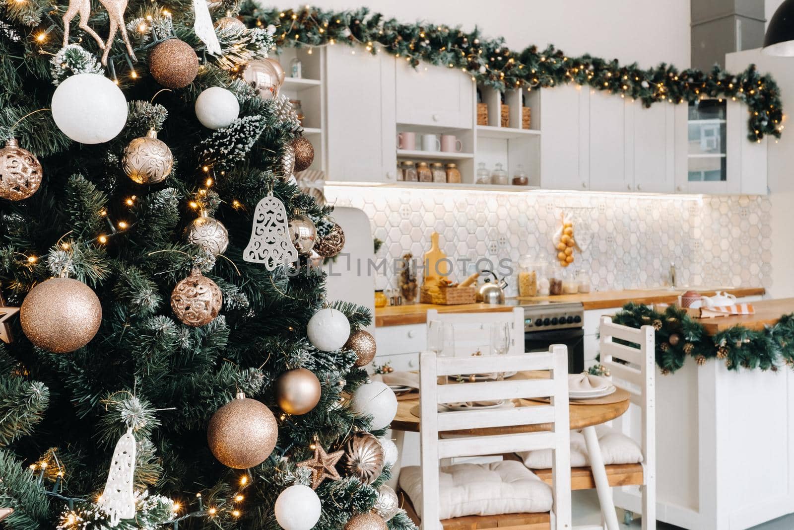 Christmas tree in the home Christmas interior in the kitchen.Decorated Christmas photo zone.