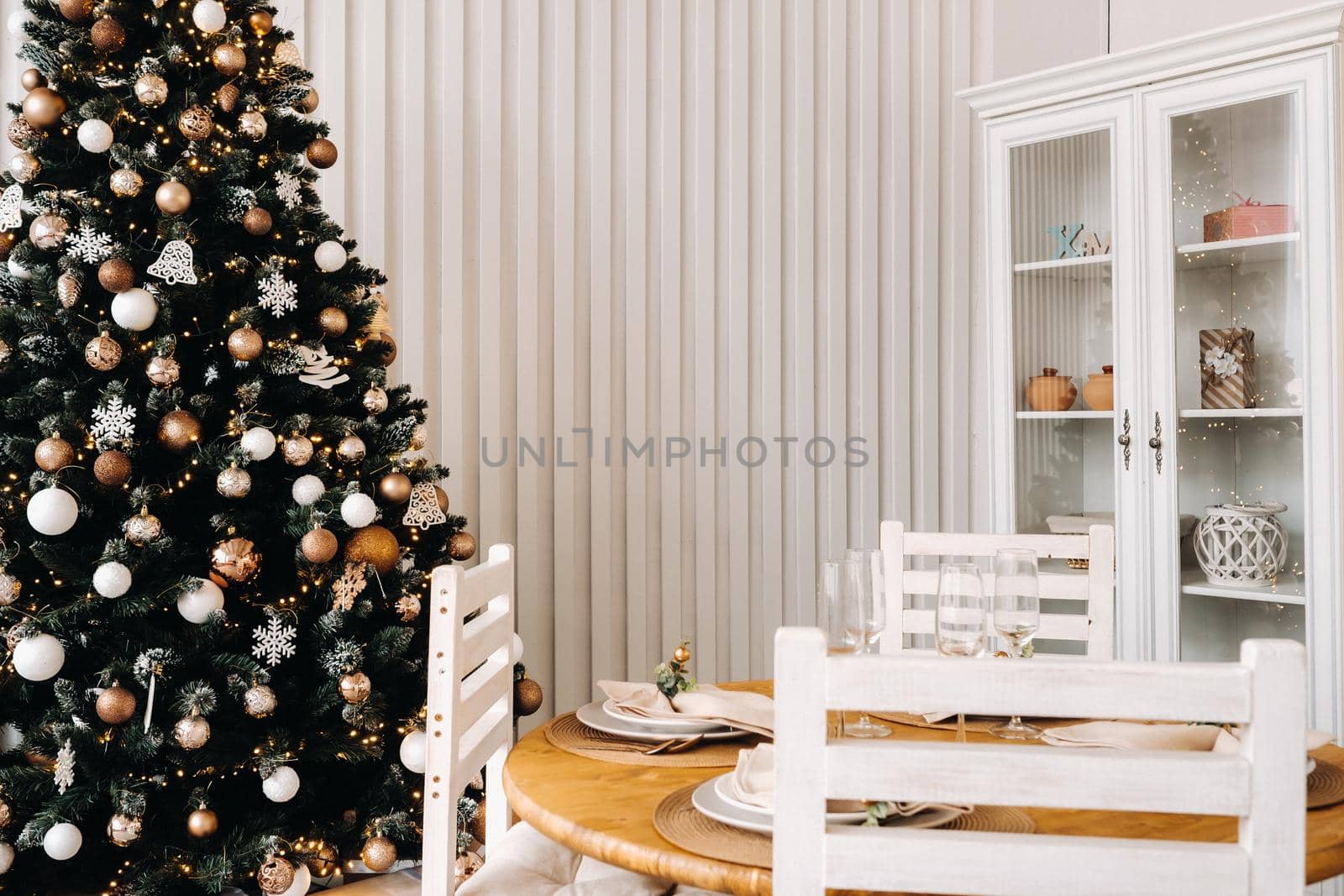 Christmas tree in the home Christmas interior in the kitchen.Decorated Christmas photo zone.