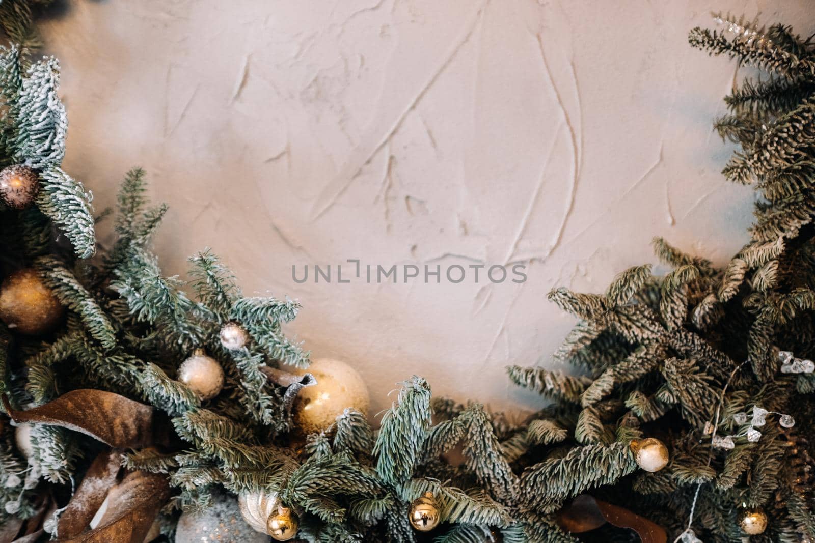 Christmas background with Christmas tree and decoration on light background by Lobachad