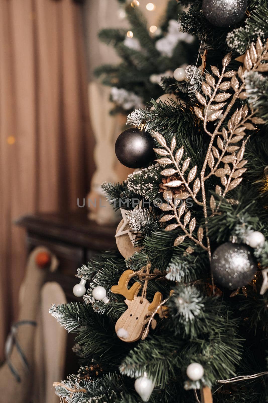 Christmas tree close-up. On New year's eve, a decorated snow-covered Christmas tree. by Lobachad