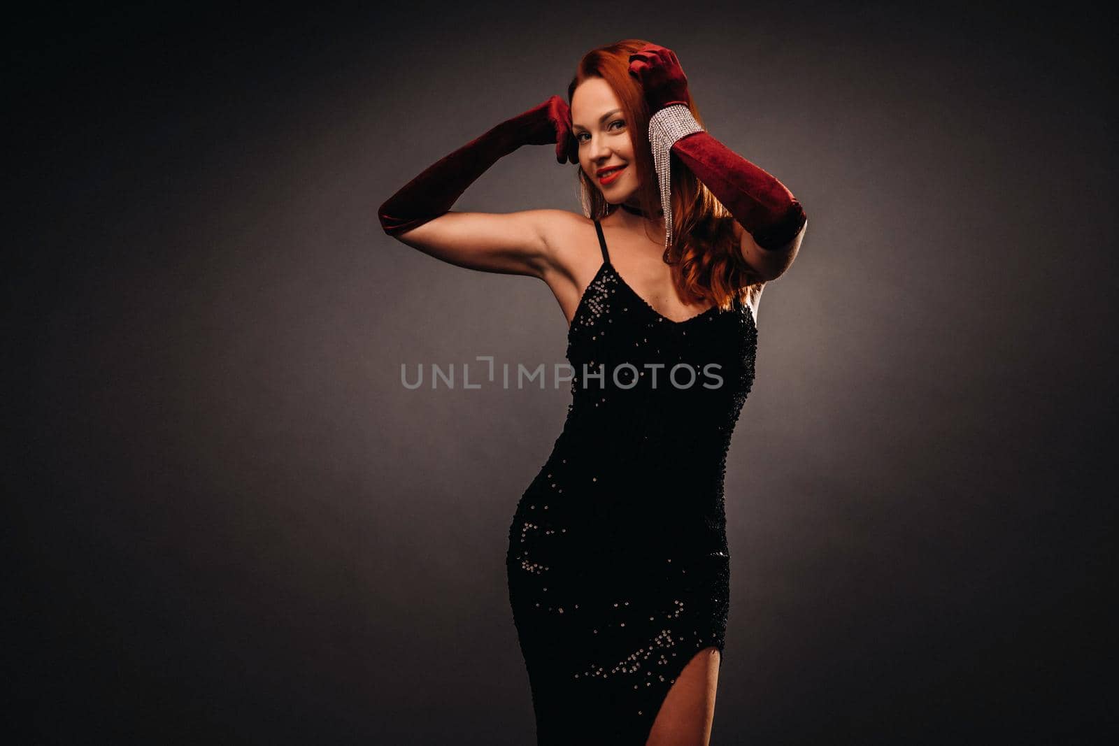 Red-haired girl in a black dress and elegant gloves on a black background by Lobachad