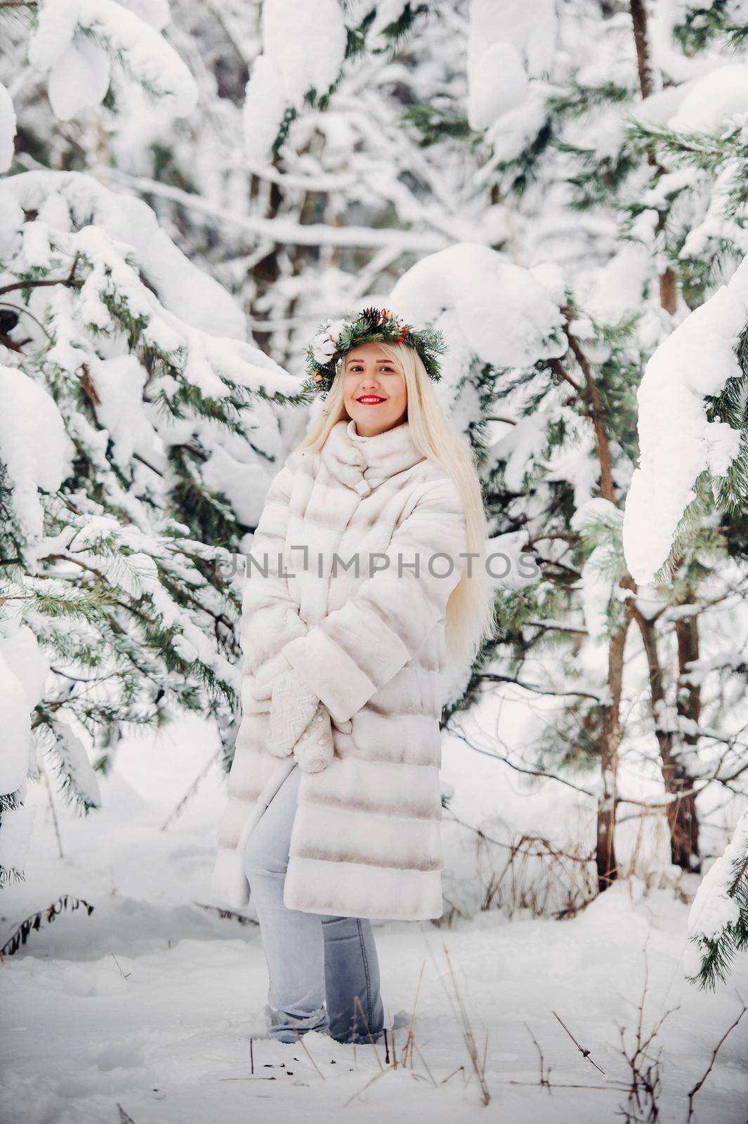 Portrait of a woman in a white fur coat in a cold winter forest. Girl with a wreath on her head in a snow-covered winter forest by Lobachad