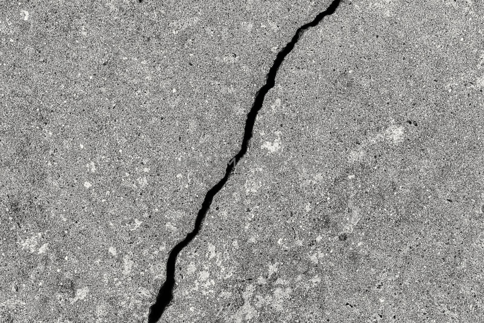 Cracked texture of gray concrete. Abstract background for design.