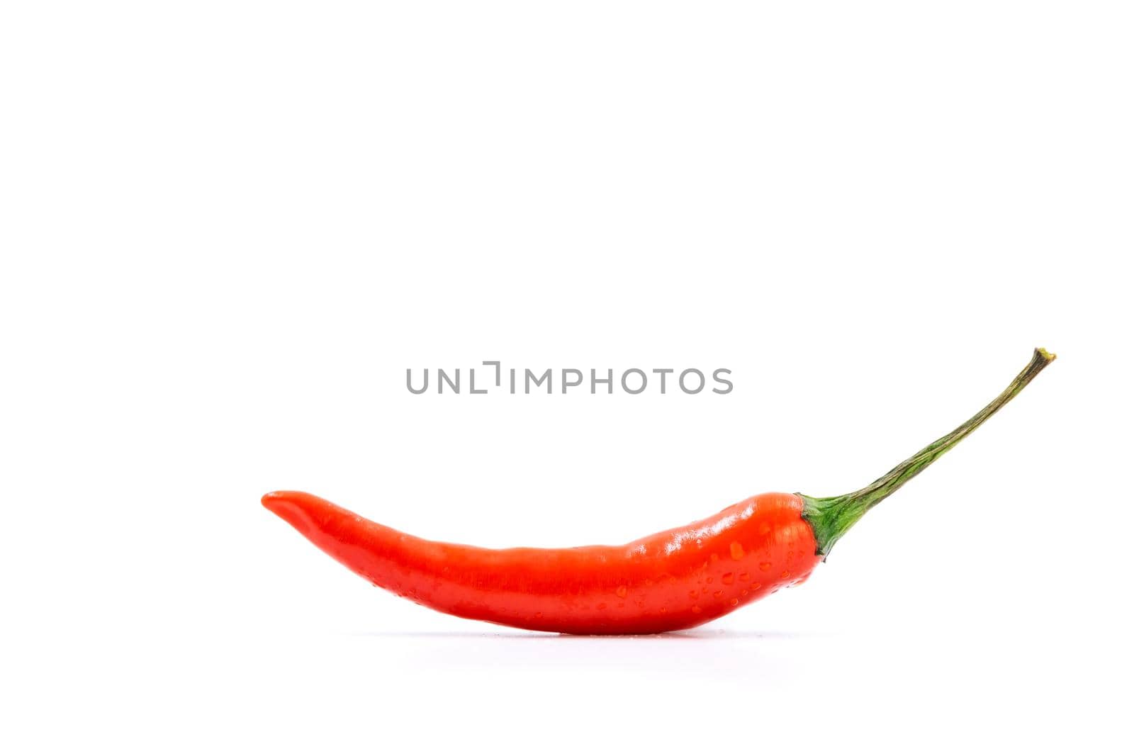 Single fresh red pepper isolated on white background with copy space.