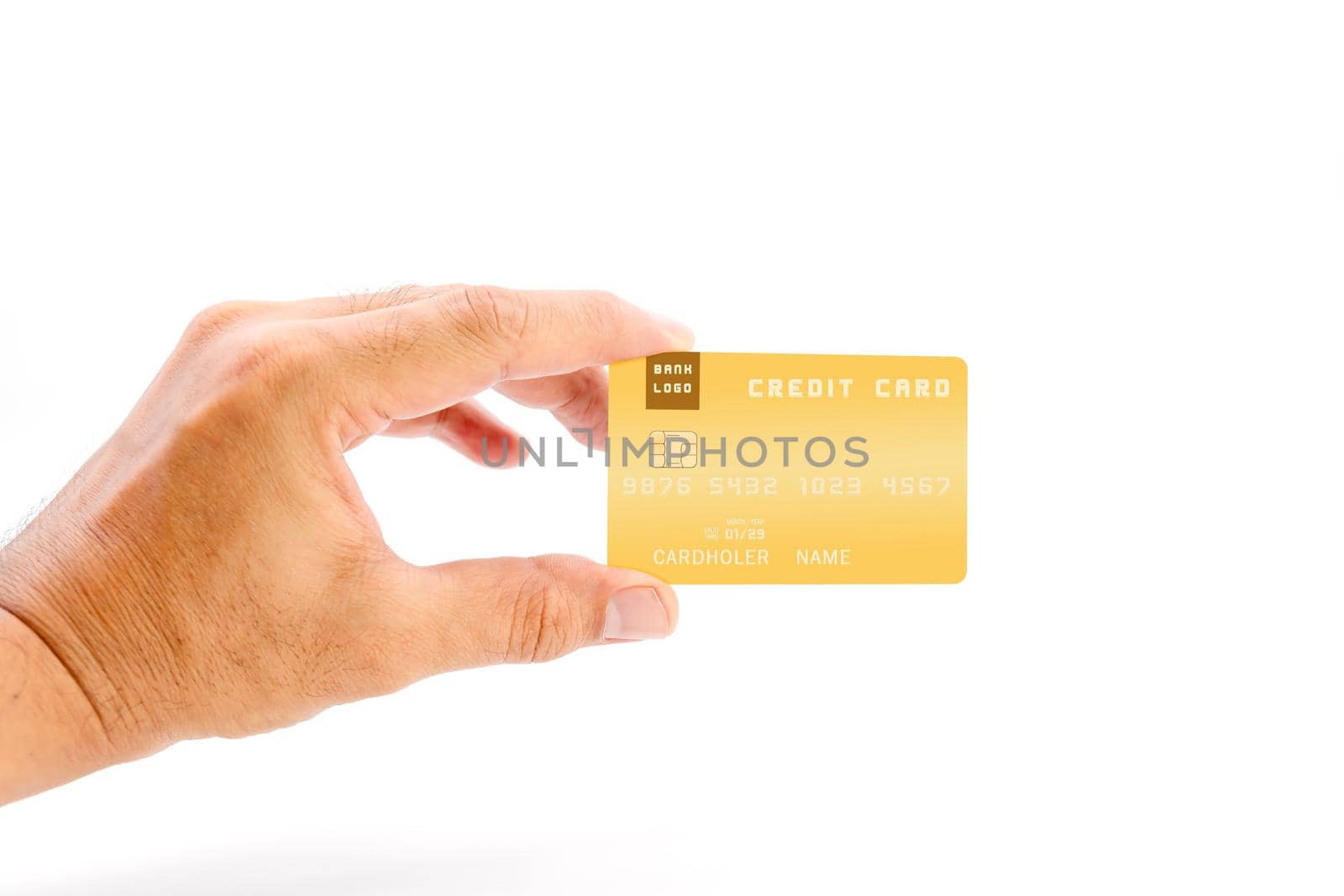 Human hand holding yellow color bank credit card on white background, use for business and finance concepts.