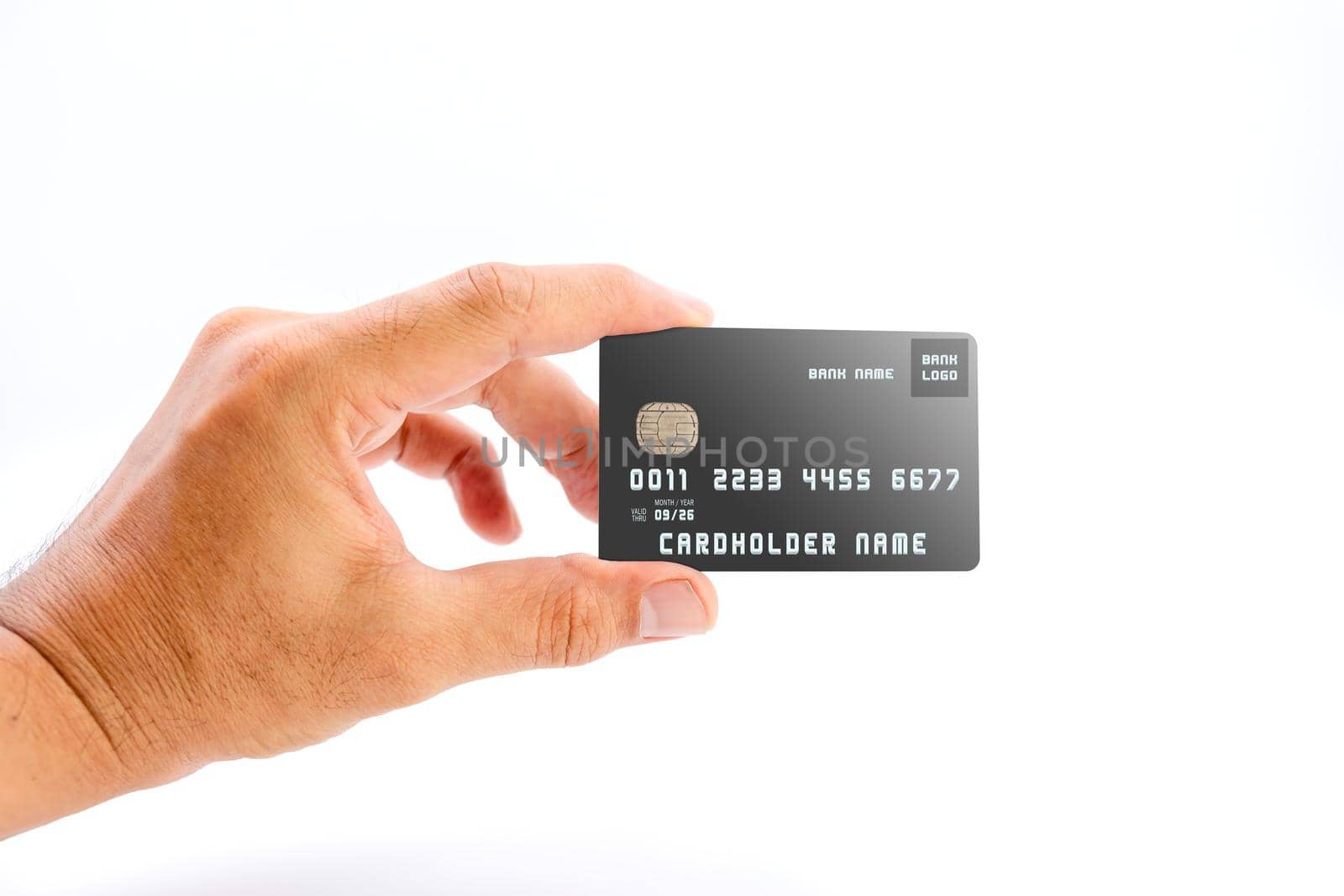 Human hand holding black color bank credit card on white background, use for business and finance concepts. by wattanaphob