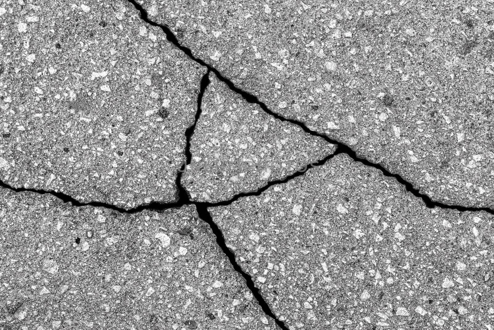 Cracked texture of gray asphalt. Abstract background for design.