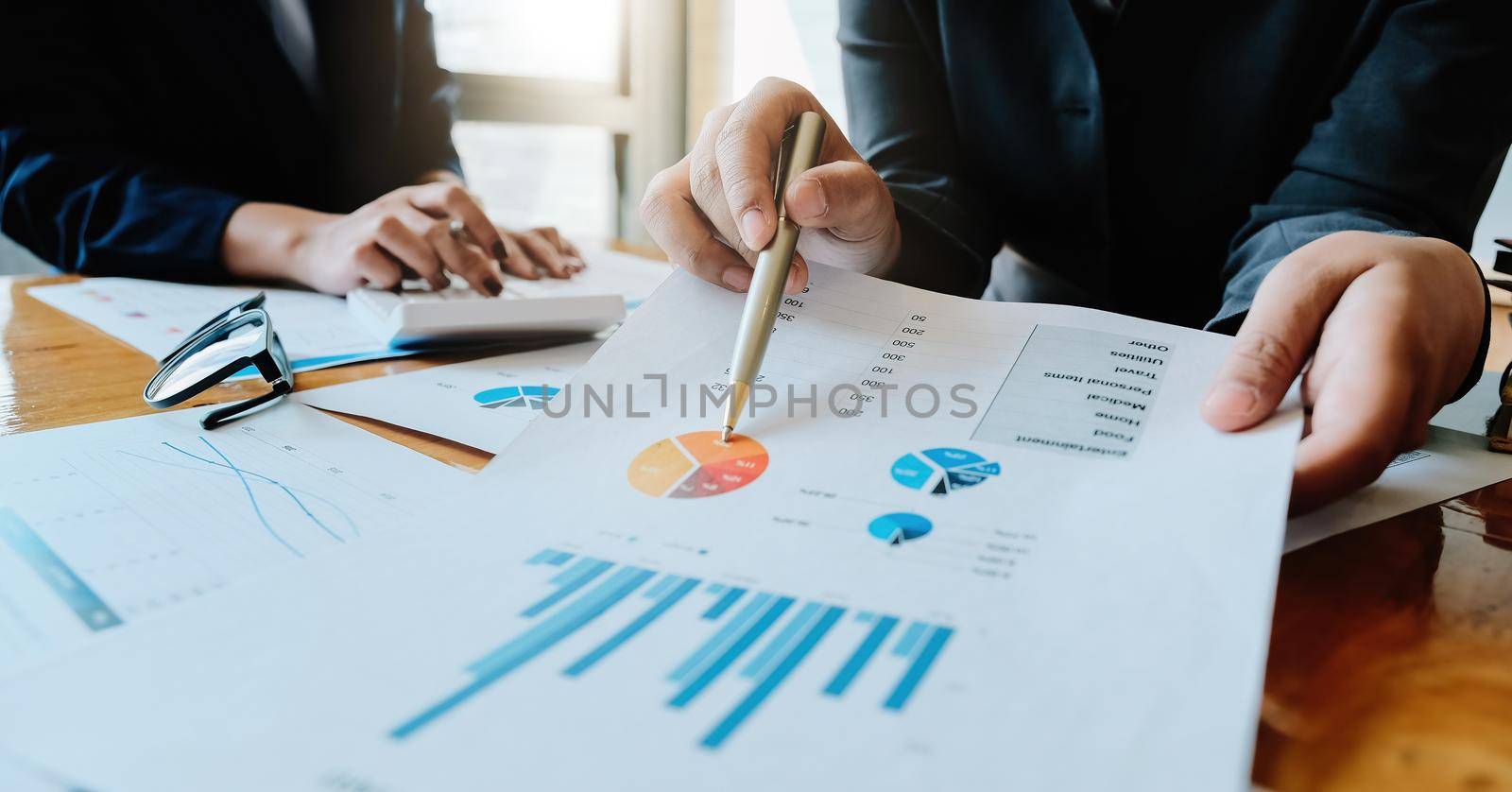 Business People Meeting Design Ideas Concept. Group of Investor diverse brainstorm and pointing at laptop computer on wooden desk by nateemee