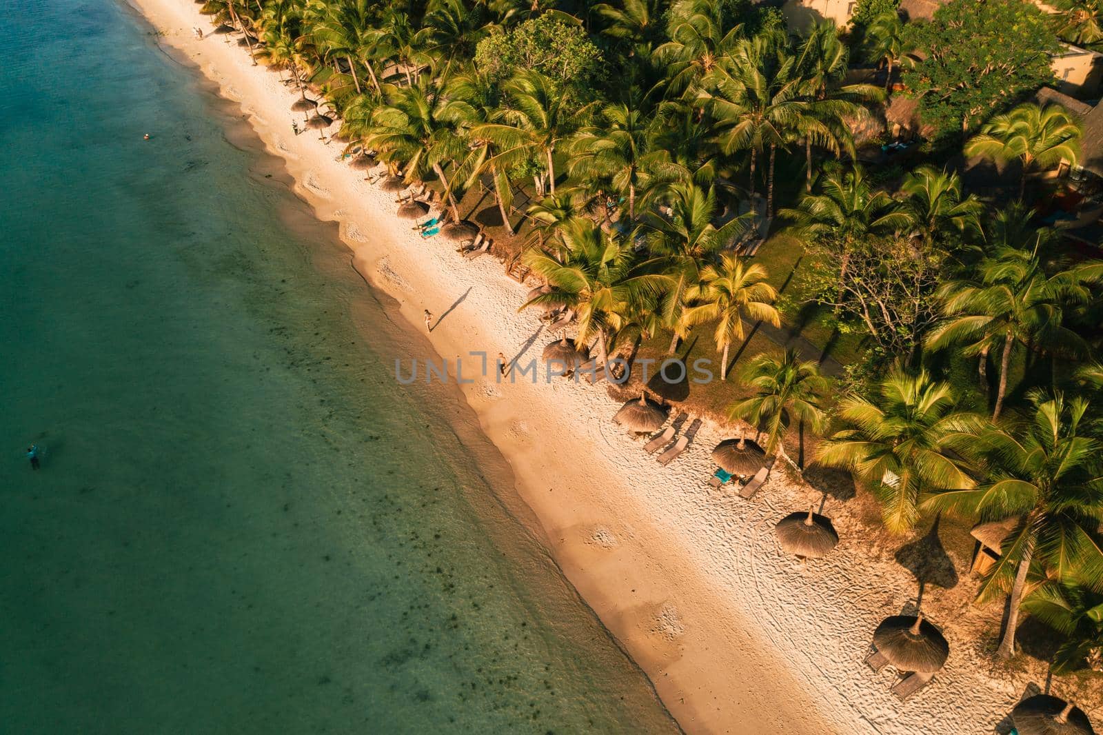 On the beautiful beach of the island of Mauritius along the coast. Shooting from a bird's eye view of the island of Mauritius