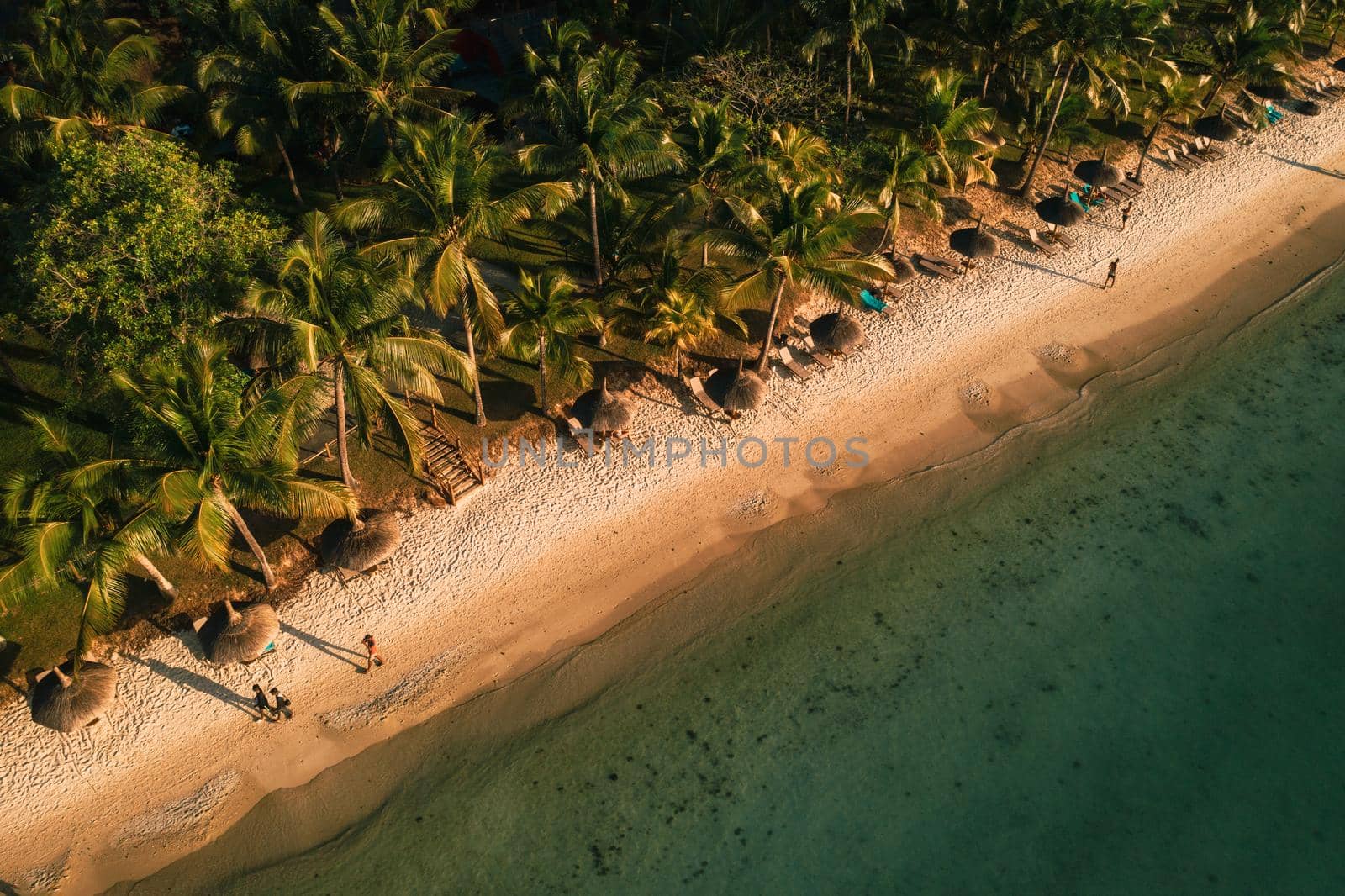 On the beautiful beach of the island of Mauritius along the coast. Shooting from a bird's eye view of the island of Mauritius. by Lobachad