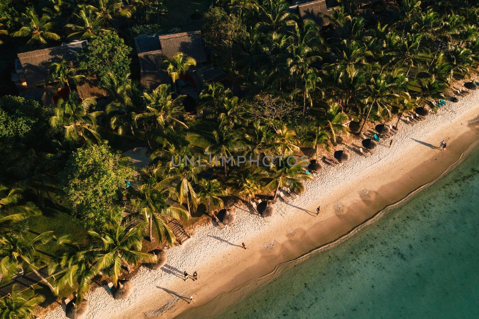 On the beautiful beach of the island of Mauritius along the coast. Shooting from a bird's eye view of the island of Mauritius