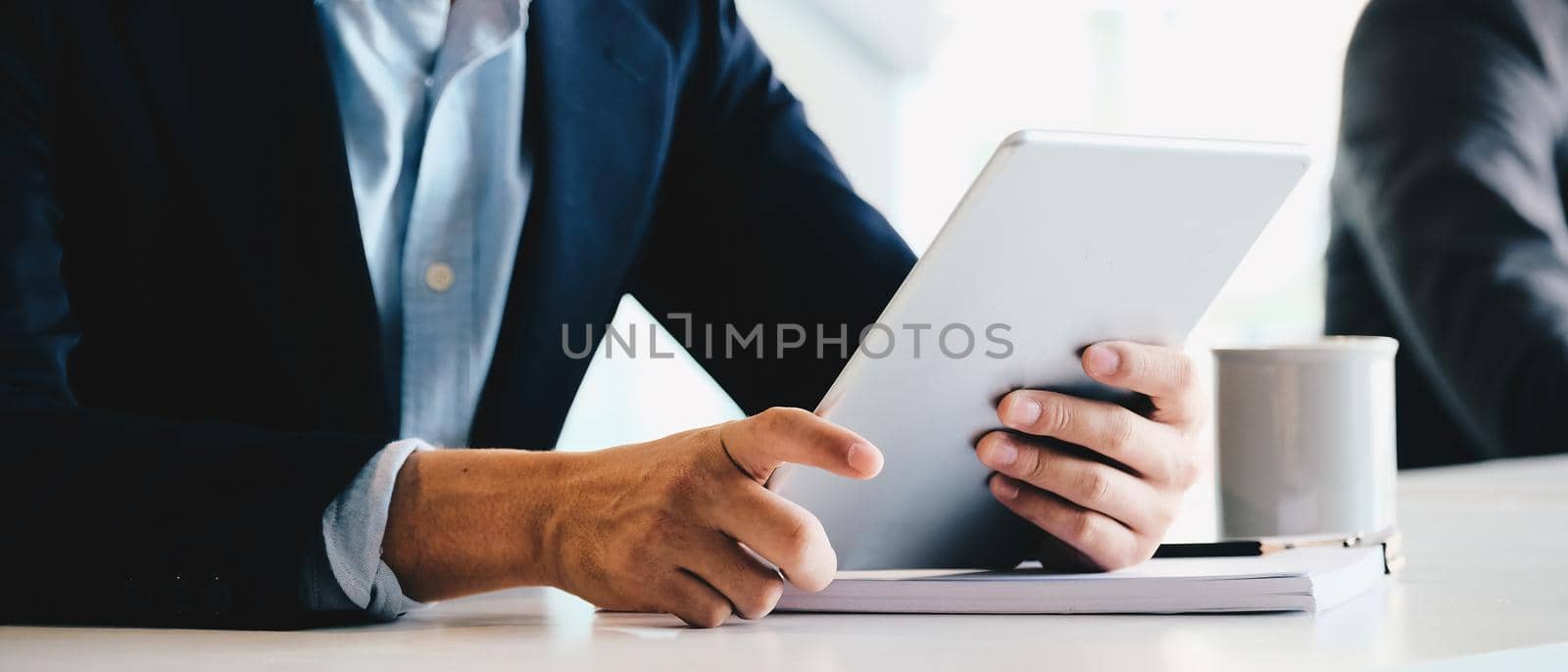 Close up businessman using digital tablet computer.