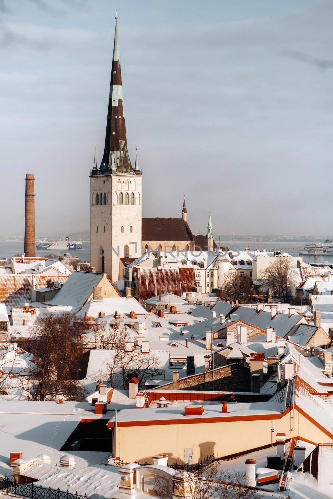 Winter View of the old town of Tallinn.Snow-covered city near the Baltic sea. Estonia by Lobachad
