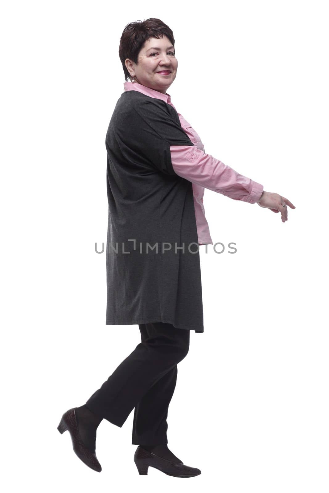 side view . adult business woman striding forward . isolated on a white background
