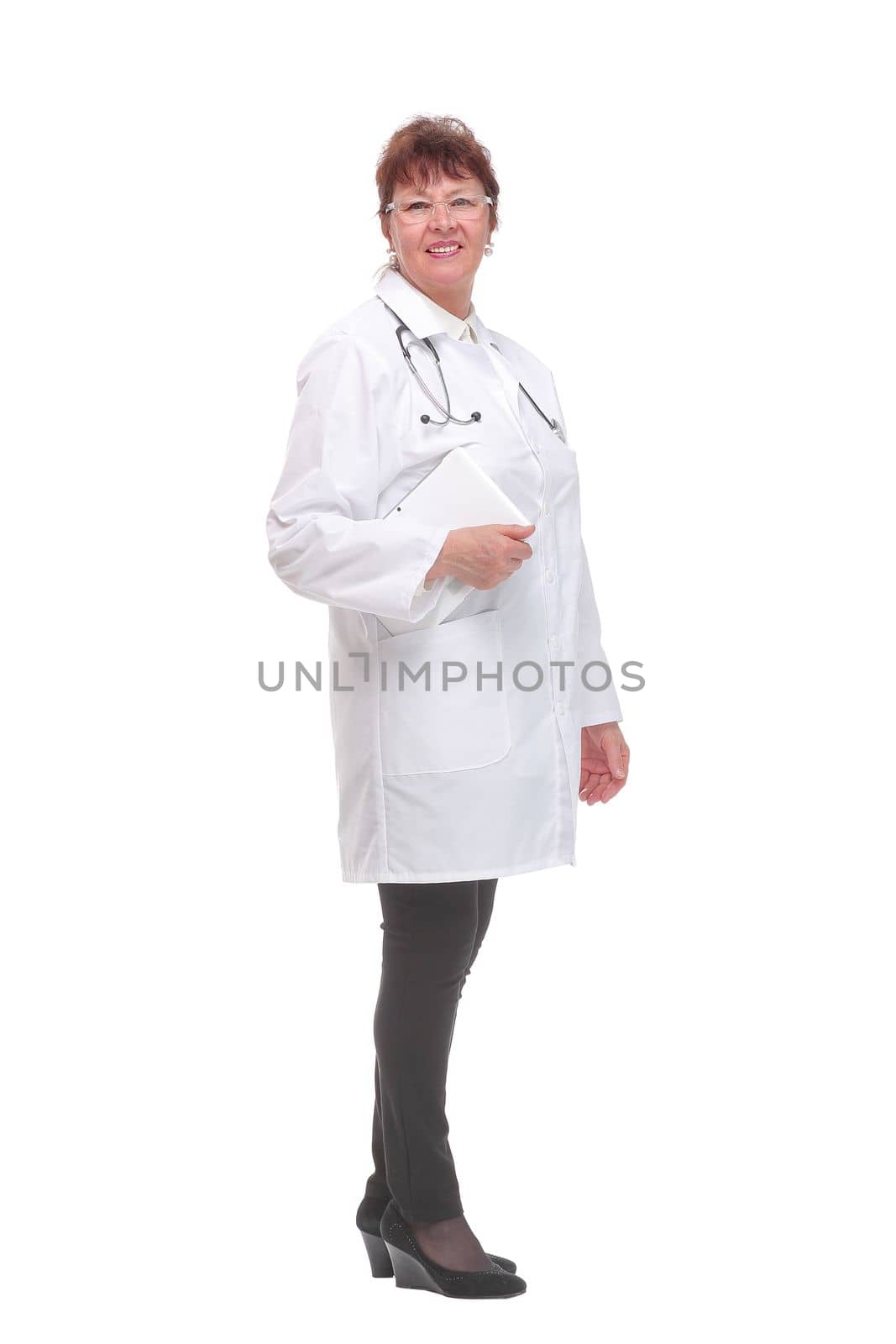 Smiling medical doctor woman with tablet computer looking at camera. Isolated on white background.
