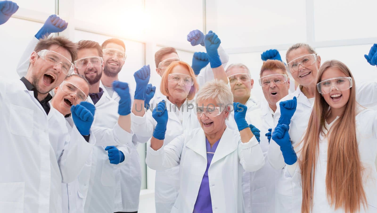close up. large group of medical researchers showing their success. photo with a copy-space.