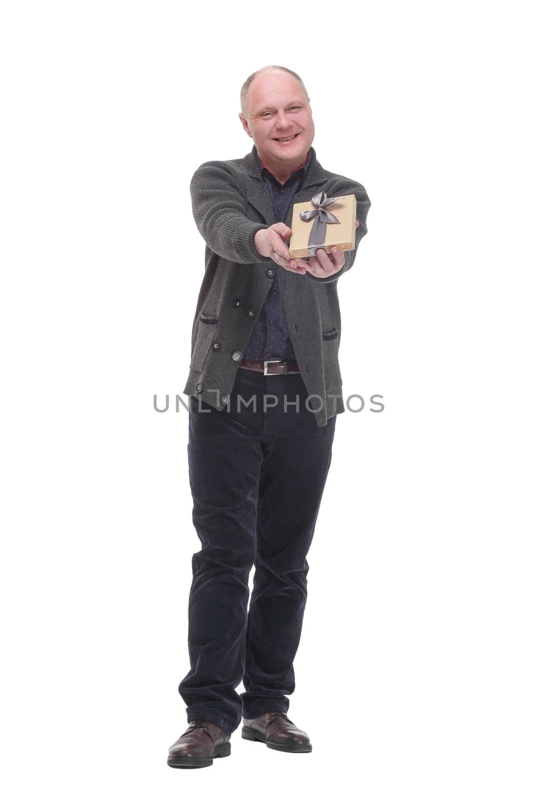 in full growth. happy mature man with gift box .isolated on a white background.