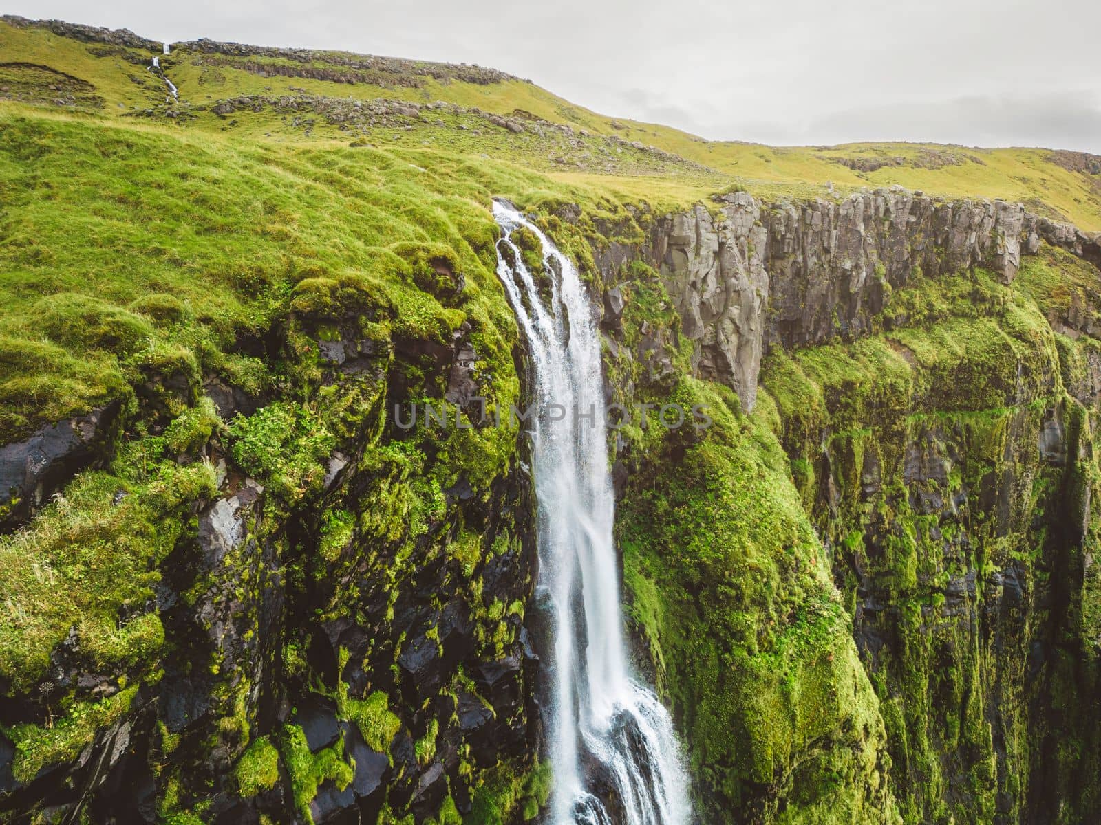 Iceland waterfall nature travel landscape in Icelandic nature background. Popular tourist attraction summer holiday destination in on South Iceland. High quality photo