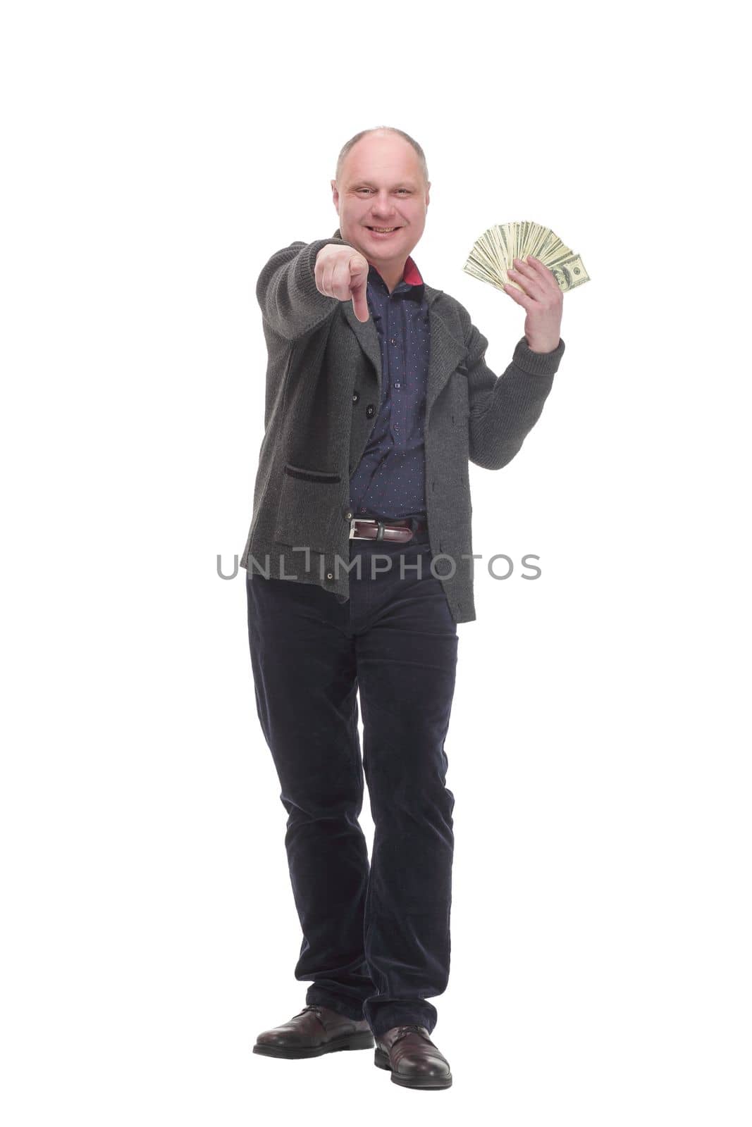 happy casual man with dollar bills .isolated on a white background. by asdf