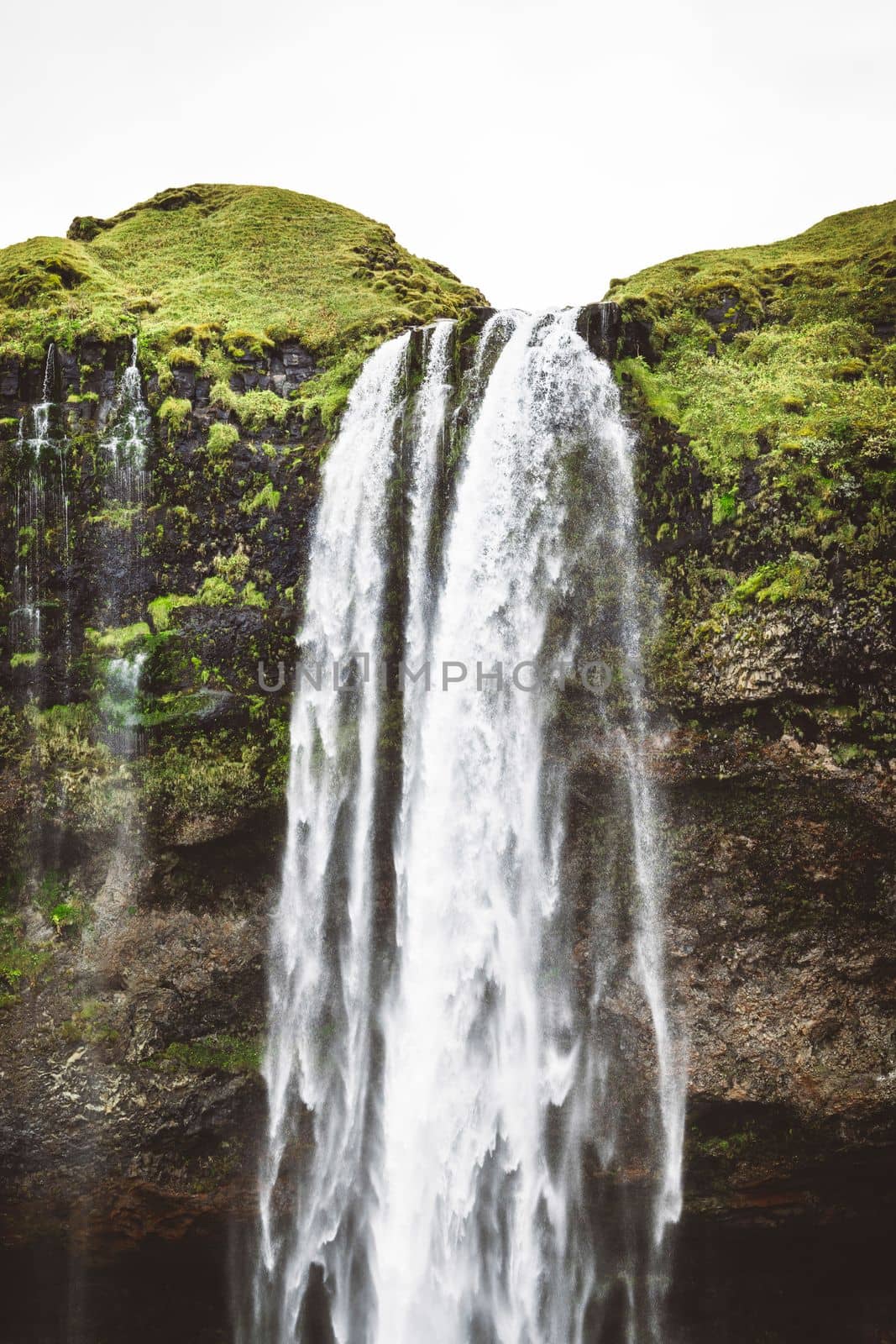 Vertical photo perfect view of famous powerful Gljufrabui cascade in sunlight. Dramatic and gorgeous scene. Unique place on earth. Location place Iceland, sightseeing Europe. Explore the world's beauty and wildlife. High quality photo