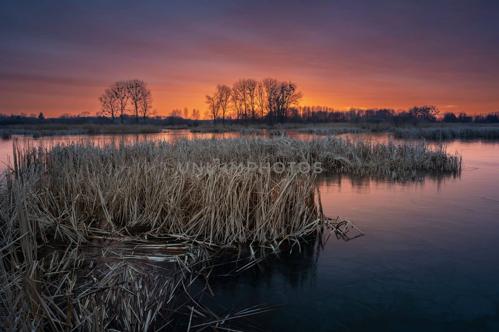 Beautiful colorful sky over the lake after sunset, Stankow, Poland