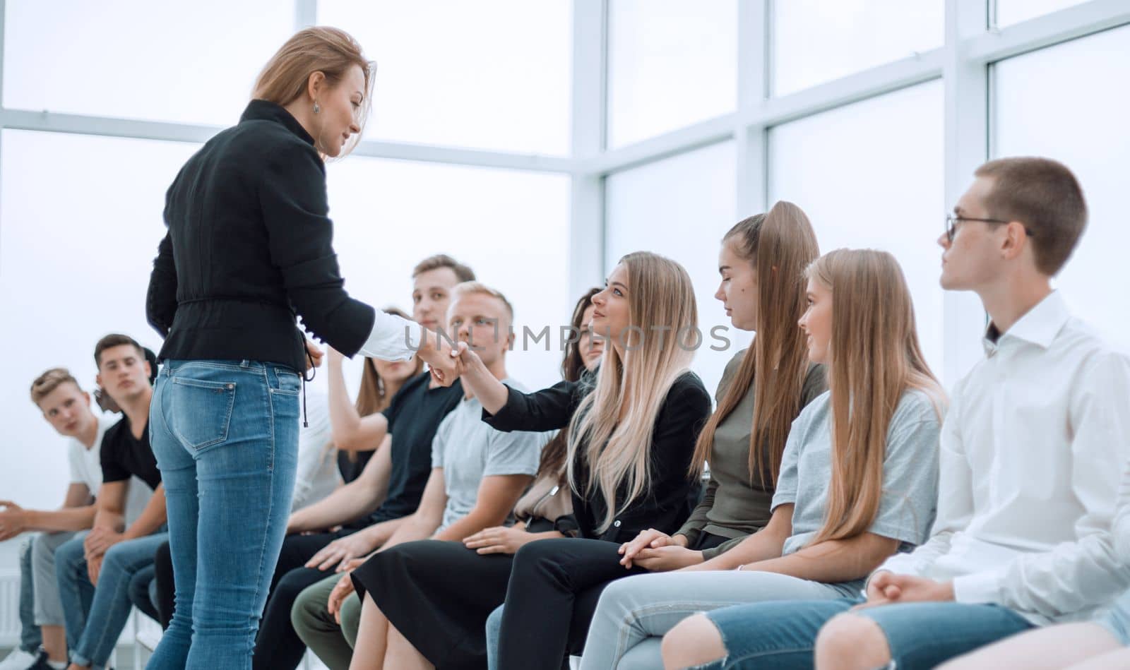 handshake of young people during business training. business and education
