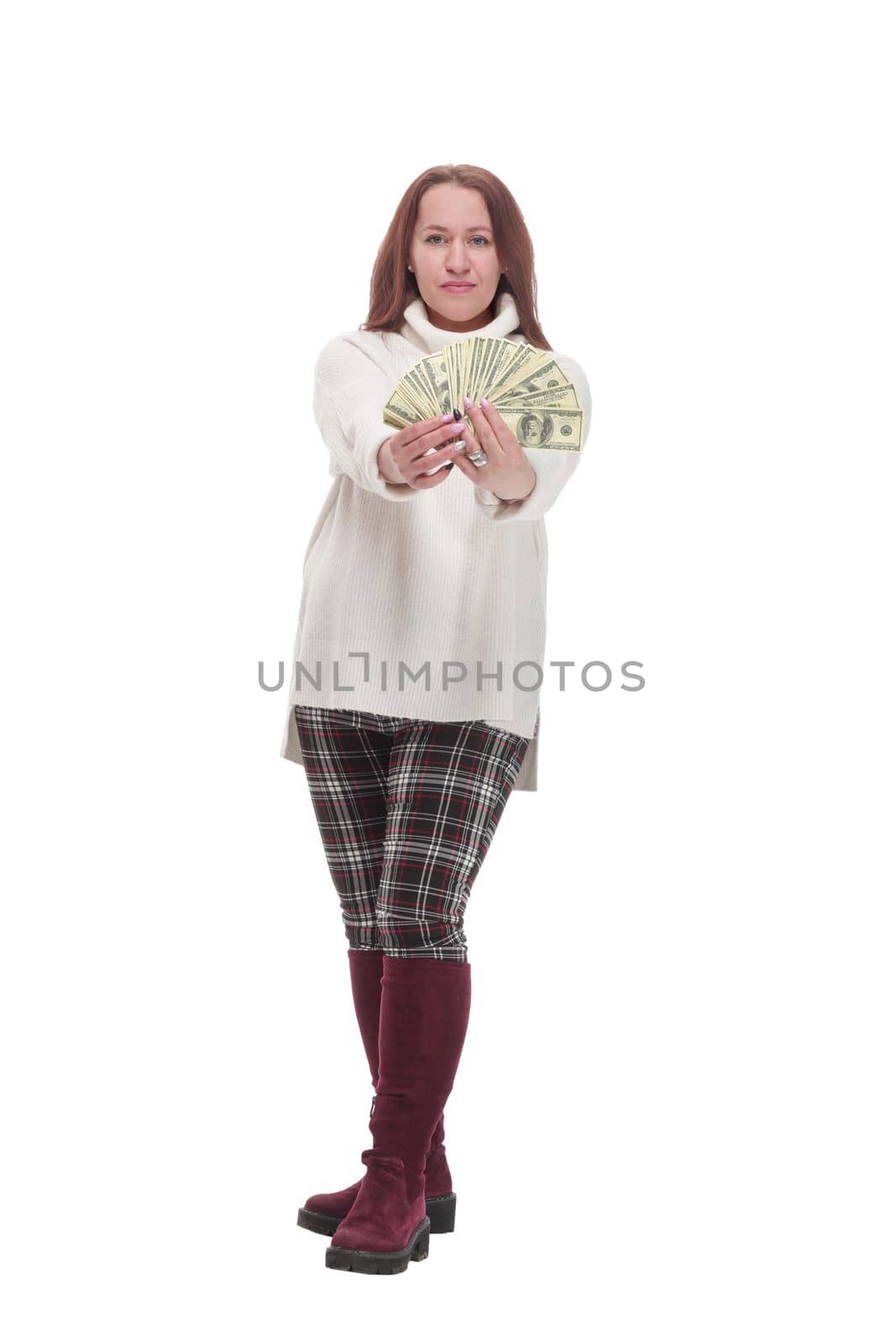 in full growth. casual happy woman with banknotes .isolated on a white background.