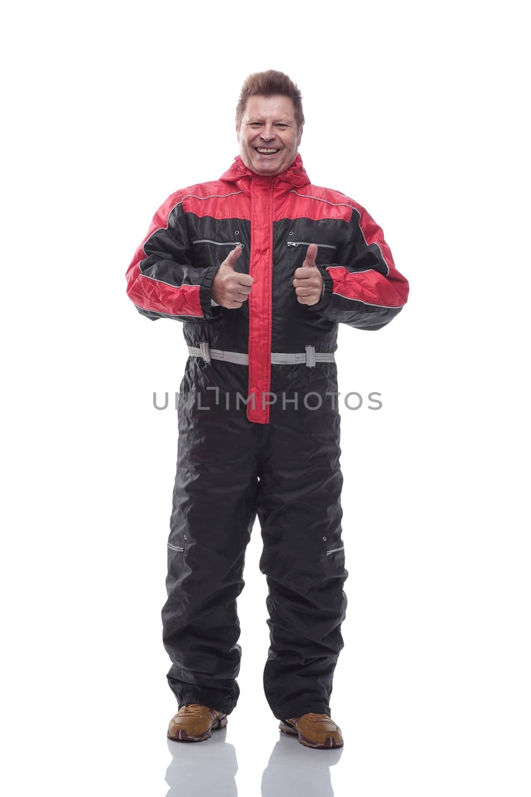 in full growth. happy man in winter insulated overalls. isolated on a white background