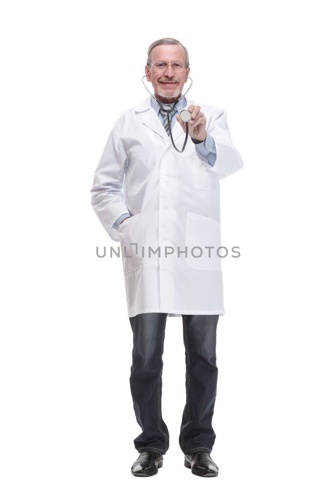 Thoughtful doctor wearing glasses examining X-ray image while standing isolated on white