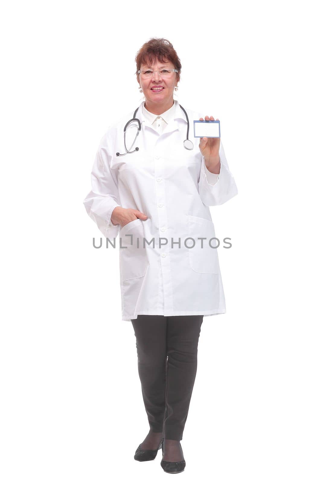 Senior woman doctor showing business card on a white background and looking at camera