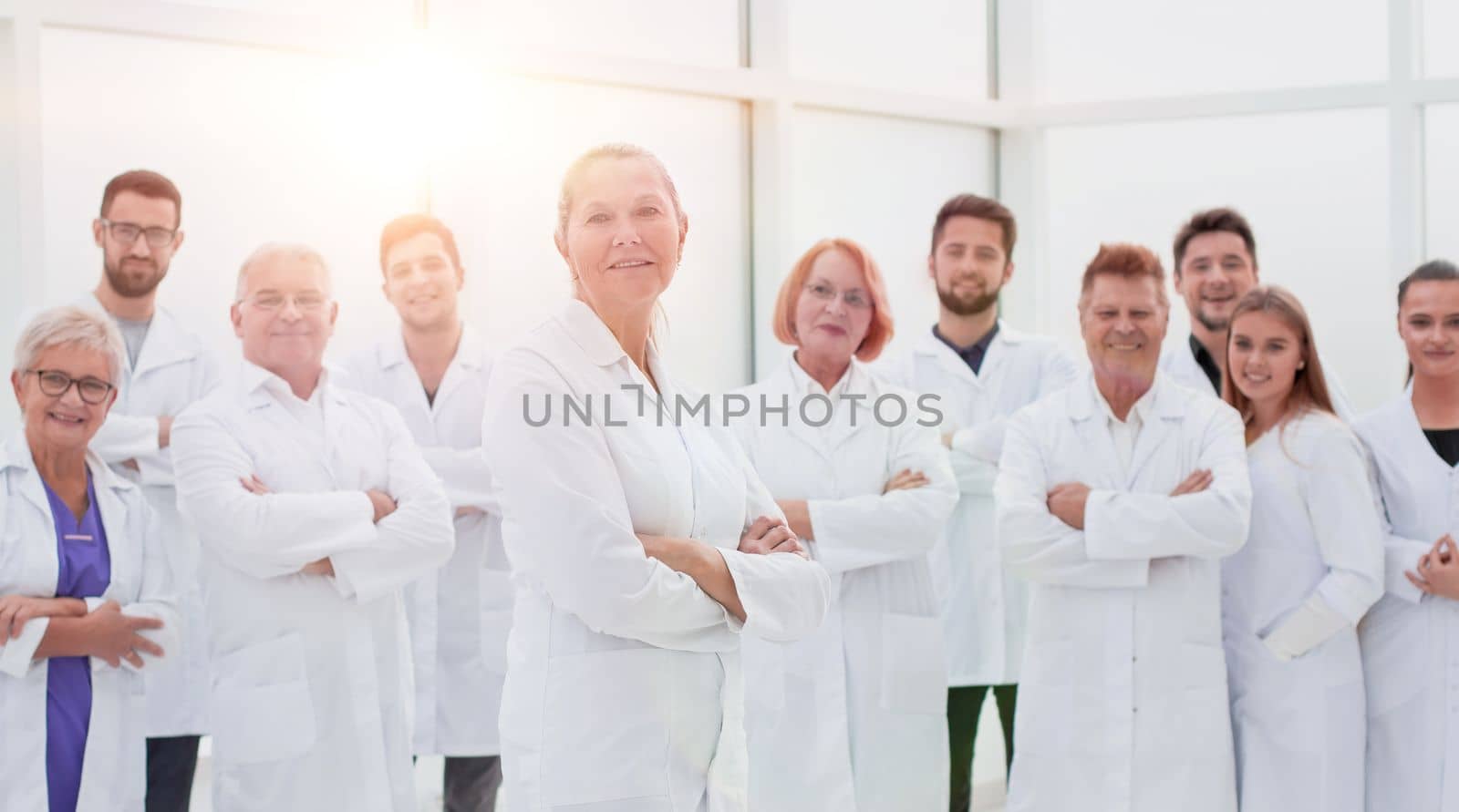 large group of people in white coats standing together. concept of health protection.