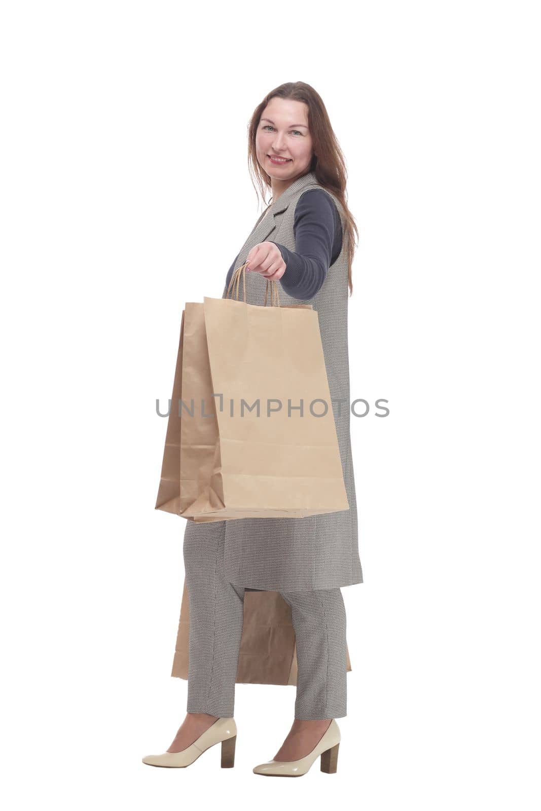 in full growth. elegant woman with shopping bags.isolated on a white background.