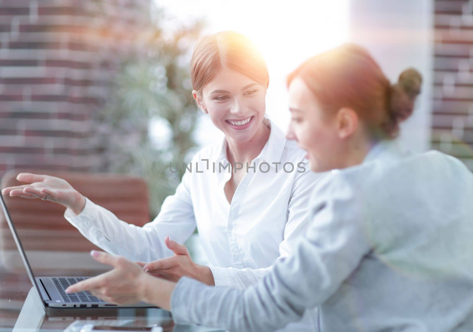 members of the business team working with laptop by asdf